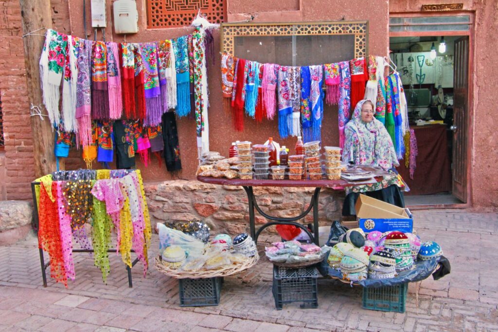 Saleswoman selling handicrafts and souvenirs located in Abyaneh